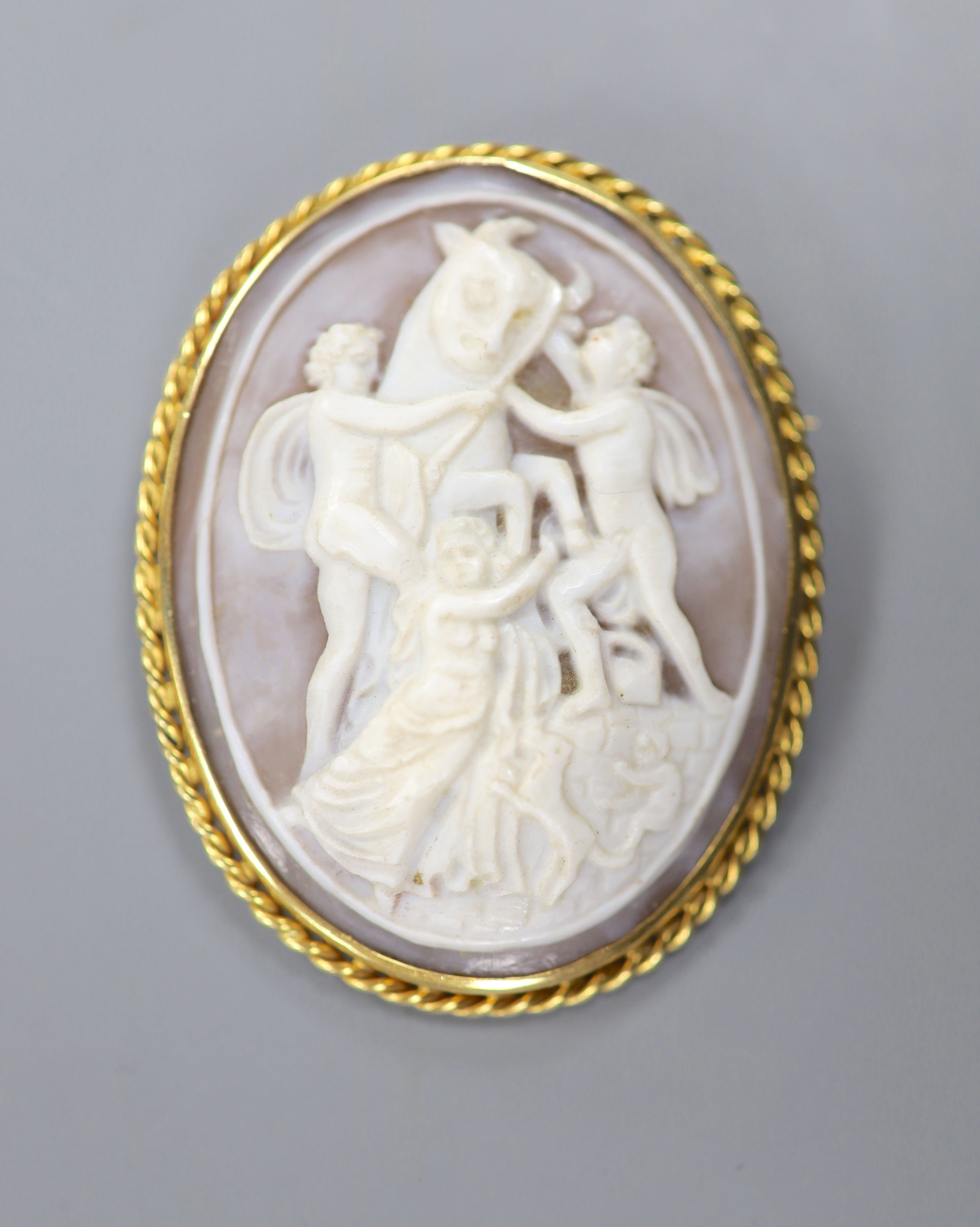 A 1970's 18ct gold mounted oval cameo shell, carved with Europa and the Bull, 53mm, gross 20.4 grams.